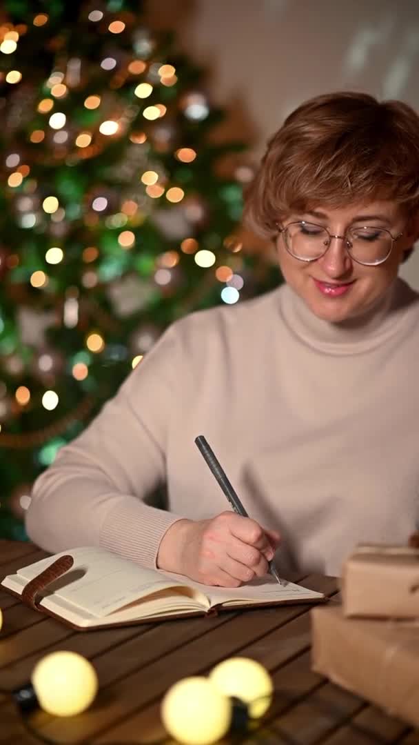 Woman Writes Wish List Christmas Night Concept Goals Plans Make — Stock Video
