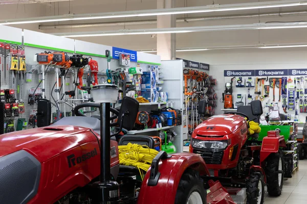 Minsk, Belarus - OCTOBER 27, 2021: garden equipment shop, tractor for farmer, tools — 스톡 사진