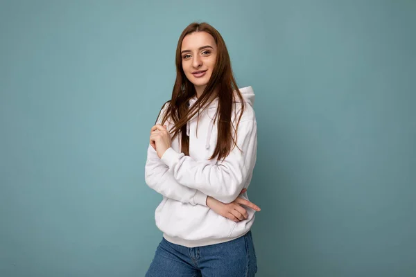 Photo shot of pretty joyful smiling young female person wearing casual trendy outfit standing isolated on colourful background with copy space looking at camera and having fun — Stock Photo, Image