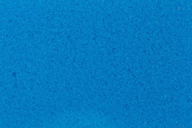 Bulaşık yıkamak için mavi süngerin arka planı, yakın plan