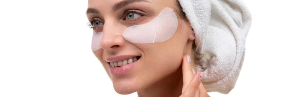 Middle aged woman with cosmetic patches on her face, spa concept — Stock Photo, Image