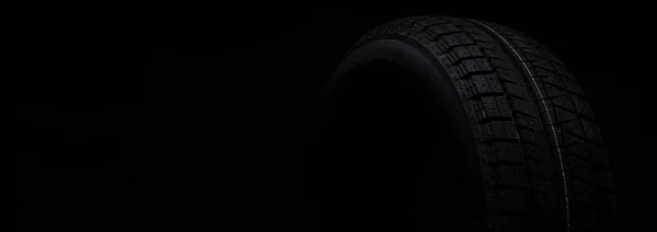 Neumático negro sobre fondo negro aislado — Foto de Stock