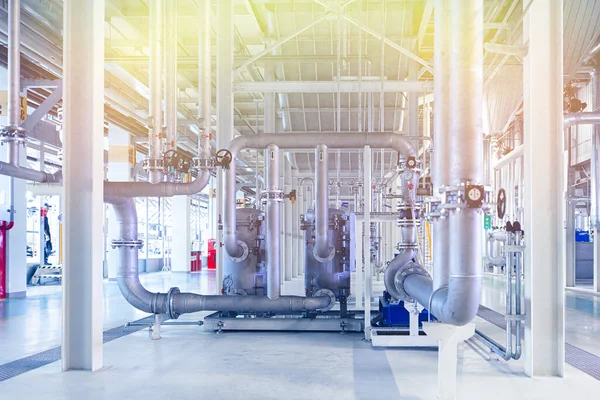 Photo of pipes and tanks. Chemistry and medicine production. Pharmaceutical factory. Yellow light tone — Stock Photo, Image