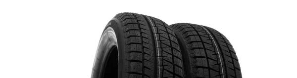 Two winter tires we with a tread against ice and snow on a white background — Stock Photo, Image