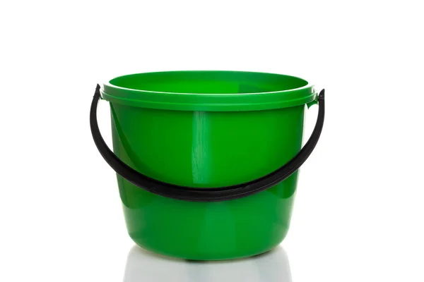 Empty plastic green bucket with black handle on white isolated background — Stock Photo, Image