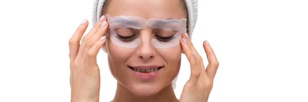 Close-up of middle aged woman eye care cosmetic mask for bags under eyes — Stock Photo, Image