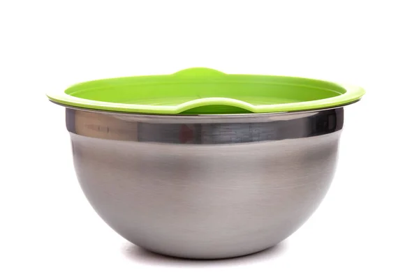 Metal salad bowl made of brushed stainless steel with green plastic lid on a white background — Stock Photo, Image