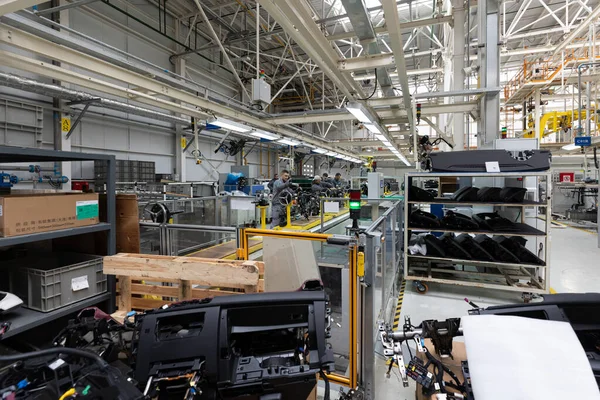 Minsk, Belarus - Dec 15, 2021: Photo of car bodies are on assembly line. Factory for production of cars. Modern automotive industry — Stock Photo, Image
