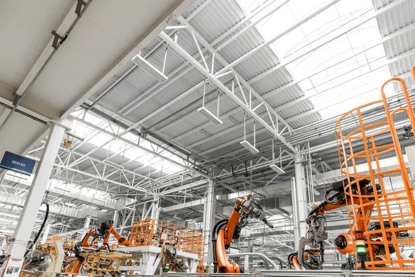 Photo of automobile production line. Welding car body. Modern car assembly plant. Auto industry. Interior of a high-tech factory, modern production — Stock Photo, Image