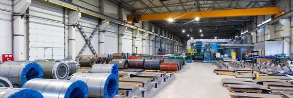 Panoramic photo shot. Metal sheet profile forming machine, process of making steel tile for roof, industrial manufacturing. Background of plant and factory. Industrial concept — Stock Photo, Image
