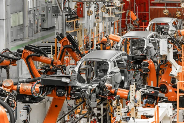 Photo of automobile production line. Modern car assembly plant. Modern and high-tech automotive industry — Stock Photo, Image
