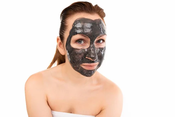 Portrait of a woman We are after thanks and cosmetic procedures with a black mask for skin care — Stock Photo, Image