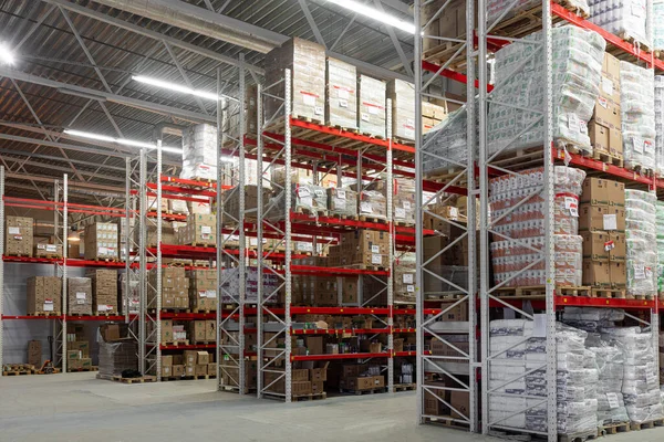 warehouse center with high racks designed to store goods before sending them to the store