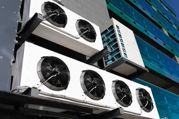industrial air conditioner units outside the building.
