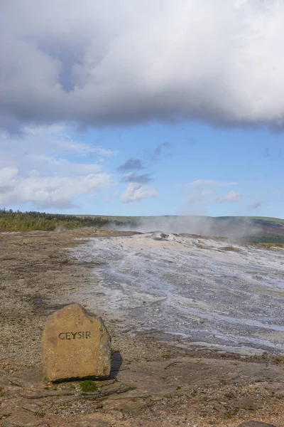 Haukadalur, Iceland: Stone marker at the site of the dormant Geysir hot spring, from which all geysers take their name.