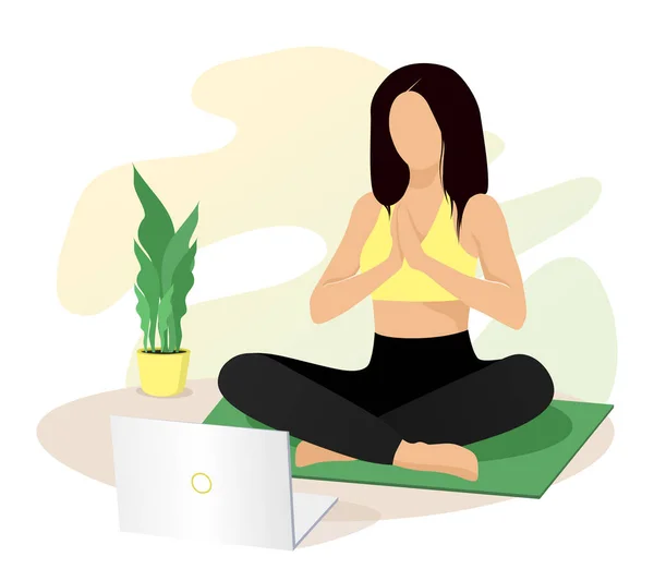 Bilgisayarda online dersler izleyen, yoga, meditasyon ve egzersiz yapan bir kadın. Canlı yayın, internet eğitimi