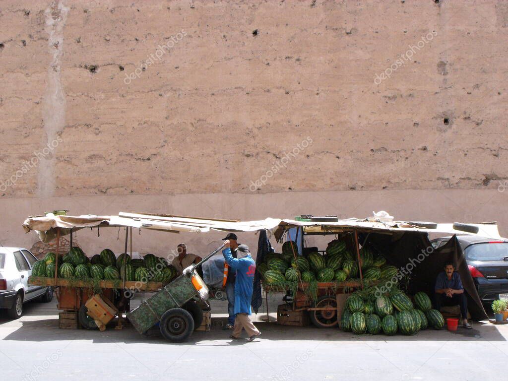Marrakech, Morocco, August 13, 2012: Stall selling watermelons next to the wall of Marrakech. Morocco