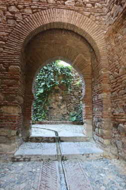 Malaga, Spain, May 8, 2022: Nasrid arches in the corridors of the Alcazaba of Malaga. Palatial fortification from the Islamic era built in the 11th century