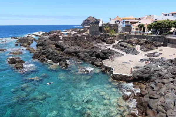 Garachico, Tenerife, Canary Islands, Spain, July 6, 2022: El Caleton natural pools next to the castle of San Miguel in Garachico, Tenerife. Spain