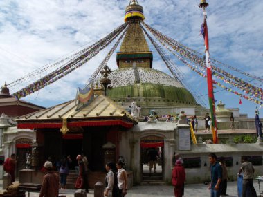 Kathmandu, Nepal, August 20, 2011: Group of people under the great Boudhanath stupa in Kathmandu, Nepal