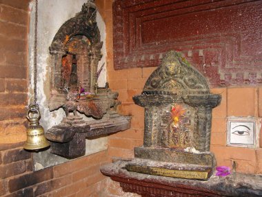 Patan, Kathmandu, Nepal, August 20, 2011: Altars inside Hiranya Varna Mahavihar. Golden Temple. Patan, Kathmandu. Nepal
