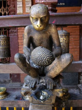 Patan, Kathmandu, Nepal, August 20, 2011: Golden sculpture of a monkey with a durian inside Hiranya Varna Mahavihar. Golden Temple. Patan, Kathmandu. Nepal