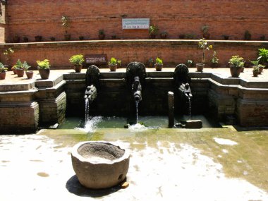 Durbar Square, Patan, Kathmandu, Nepal, August 20, 2011: Ancient cool water fountain in Durbar Square, Patan, Kathmandu, Nepal