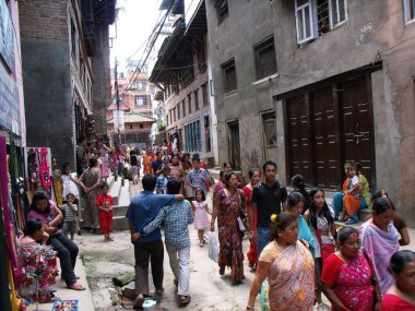 Durbar Square, Patan, Kathmandu, Nepal, August 20, 2011: Procession of worshipers on a street in Durbar Square, Patan, Kathmandu, Nepal