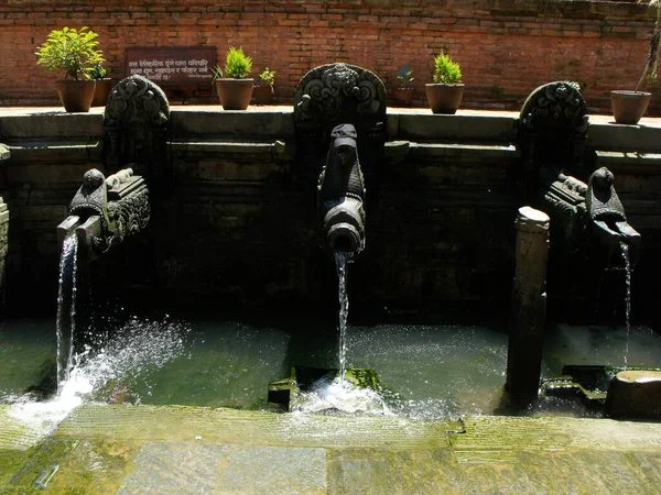 Durbar Square, Patan, Kathmandu, Nepal, August 20, 2011: Fountain in Durbar Square, Patan, Kathmandu, Nepal