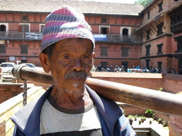 Durbar Square, Patan, Kathmandu, Nepal, August 20, 2011: Face of an elderly man in Durbar Square, Patan, Kathmandu, Nepal