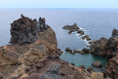 Icod de los Vinos, Tenerife, Canary Islands, Spain, August 30, 2022: Volcanic rocks on the cliffs of Punta de Juan Centellas in Icod de los Vinos, Tenerife, Spain