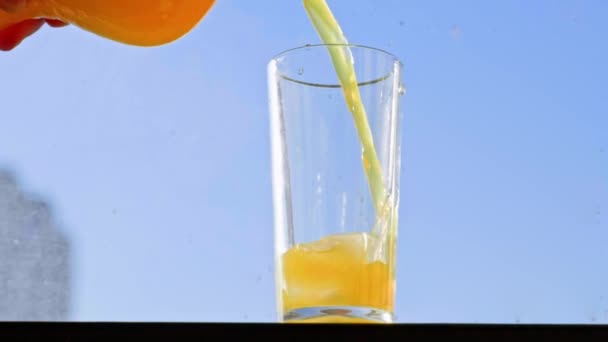 Pouring Orange Drink Glass Fhd Slowmotion — Stock videók