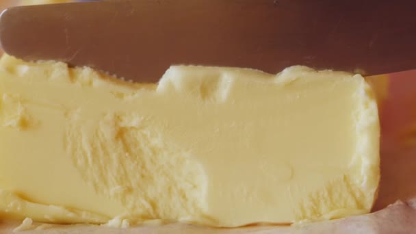 Close View Knife Cutting Piece Butter Slowmotion Uhd — Stockvideo