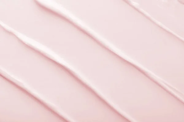 浅粉色化妆品乳白色图案为背景 — 图库照片
