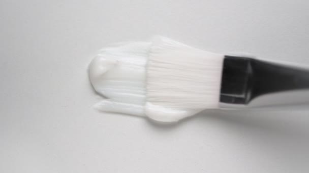 Stroking Organic Facial Cream Paintbrush White Surface Extreme Close View — Stock Video