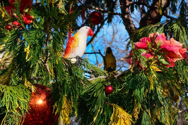 Cute Little Glass Parrots Sitting Bright Green Branch Christmas Tree — Stock Photo, Image