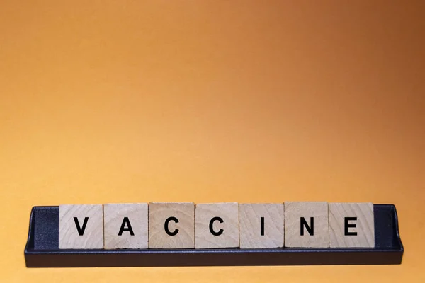 Vaccine Covid Coronavirus Letters Written Wooden Index Cards Orange Background — стокове фото