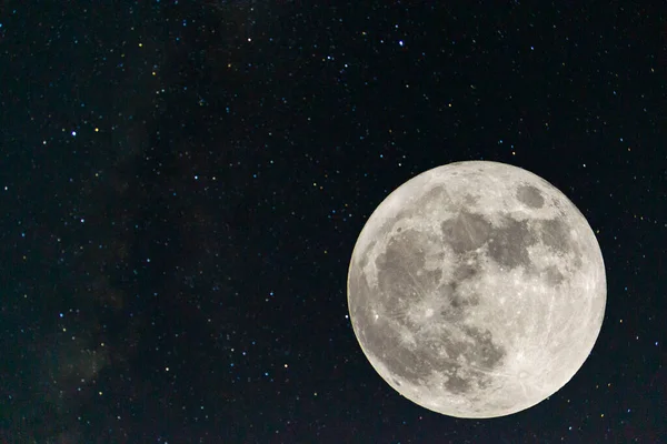 Full moon. Stars. super full moon. Full moon with the background full of stars in the galaxy. Horizontal photography. Harvest Moon. Photography. 9-10 september 2022