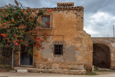 Typical rural house of the island of Mallorca, made of stone and in a state of abandonment. Image of the abandonment of the rural world clipart