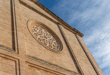 Main facade of the parish church of Sant Miquel, in the Majorcan town of Llucmajor, at dawn