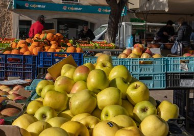 Campos, Spain; january 15 2022: Weekly street market in the Majorcan town of Campos. Vendors and customers with masks due to restrictions by the Omicron variant of Coronavirus. New normal