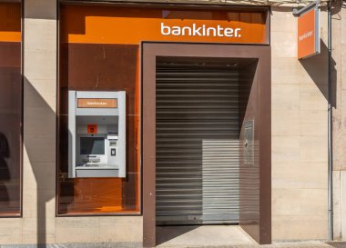 Manacor, Spain; may 14 2022: Closed bank office and ATM of the multinational bank Bankinter. Manacor, island of Mallorca, Spain
