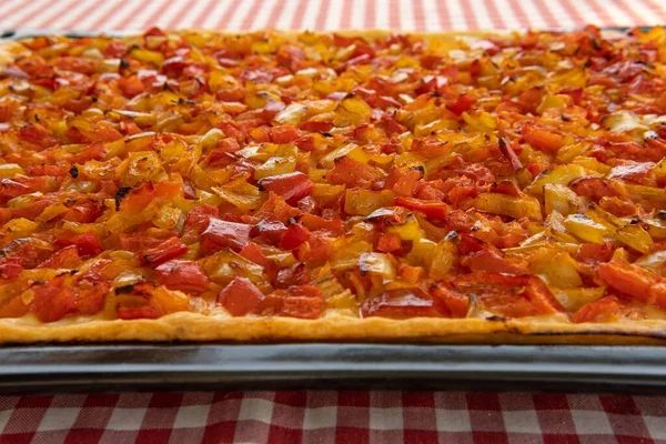Close-up of a typical Mallorcan cuisine dish, Coca de Trampo. Vegetarian and healthy dish of the Mediterranean diet