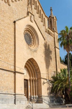 Main facade of the parish church of the Majorcan town of Arta, at sunrise on a summer day
