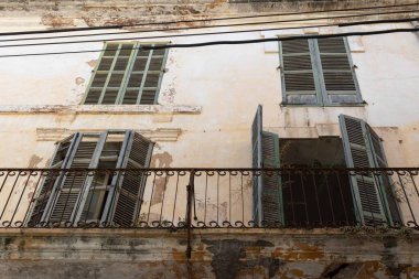 Facade of a historic and dilapidated building in the Majorcan town of Felanitx, Spain