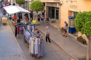Felanitx, Spain; august 21 2022: Weekly street market in the Majorcan town of Felanitx. Stalls selling clothes and handicrafts. Spain
