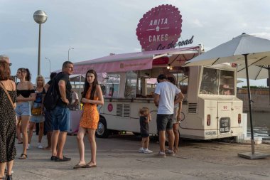 Palma de Mallorca, Spain; september 03 2022: Van Van Palma street food festival at sunset. Island of Mallorca, Spain. Van selling street food