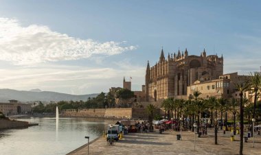 Palma de Mallorca, Spain; september 03 2022: Van Van Palma street food festival at sunset. Island of Mallorca, Spain. General view with the cathedral in the background