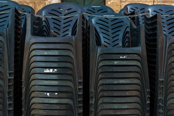 Dark Plastic Chairs Stacked Street — Stock Photo, Image