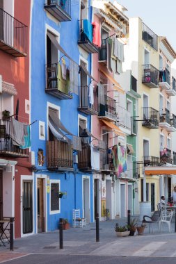 Colourful buildings typical of the town of Villajoyosa (Alicante, Spain). Faade of several buildings with the walls painted in different colours. Building with coloured walls.